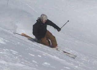Image of Boot Horn Inventor skiing in powder